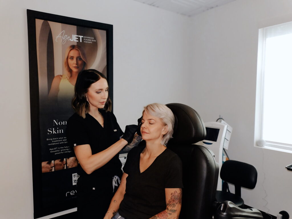 Professional injector administering Botox brow lift treatment in a clinic to enhance and open the eyes.